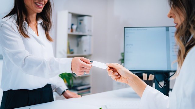 Doctors reviewing MACRA compliance and Medicare reporting strategy